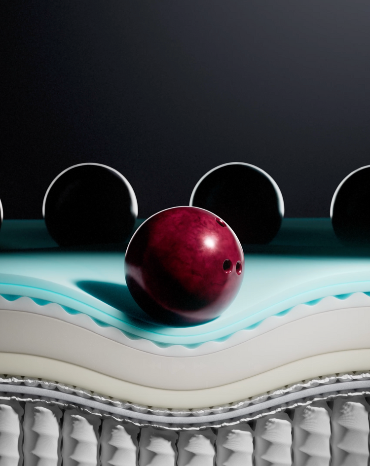 Bowling ball on layered mattress surface