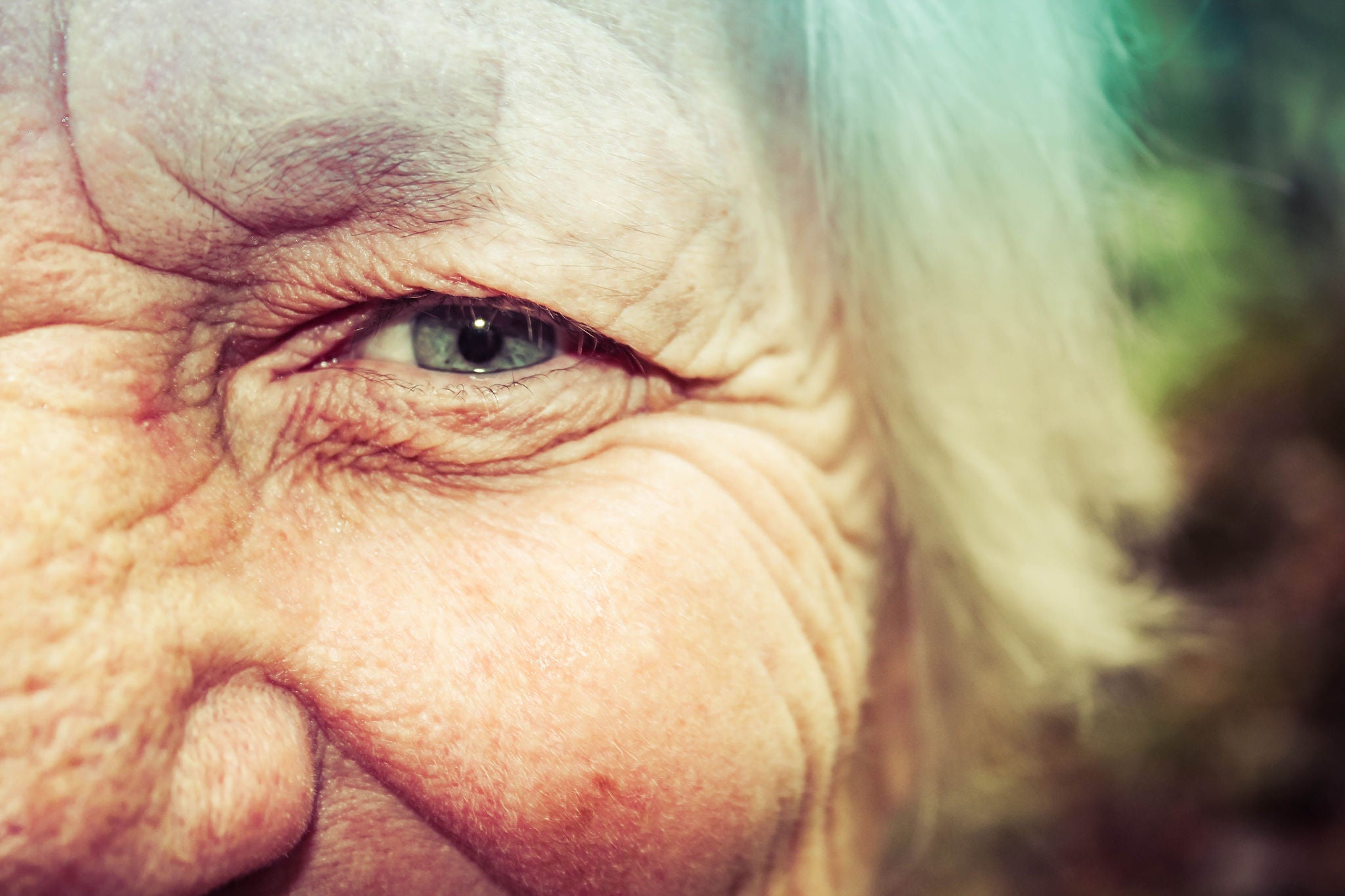 Close-up of elderly woman's face outdoors