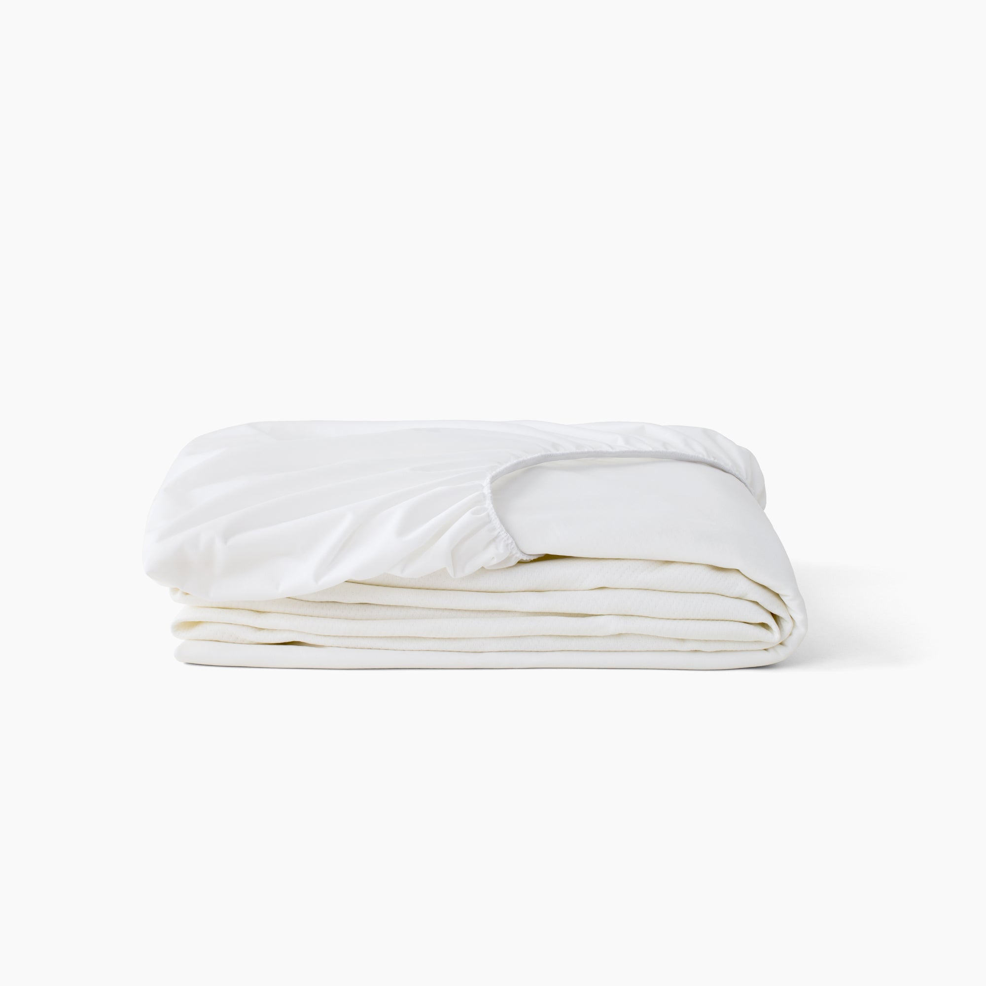 A folded white Beautyrest mattress protector with an elasticized top edge, photographed on a clean white background.